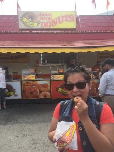 Eating mini donuts at the Calgary Stampede