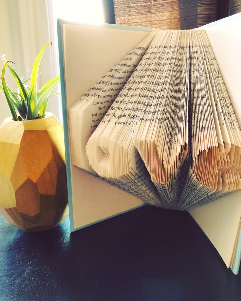 Book folding art for the word 'love'