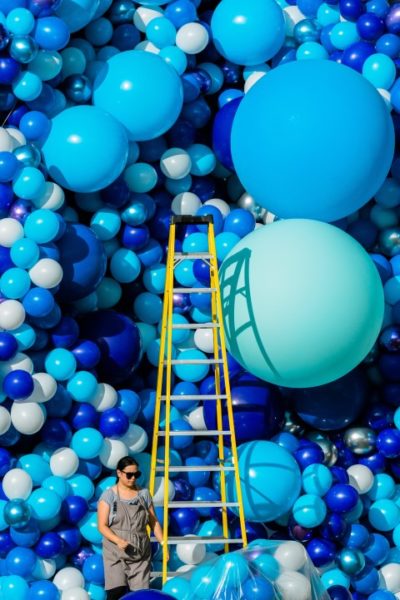 Maria Dina Galura setting up a balloon installation at Prince's Island Park.