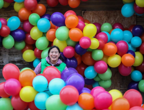 Maria Galura surrounded by her balloon art