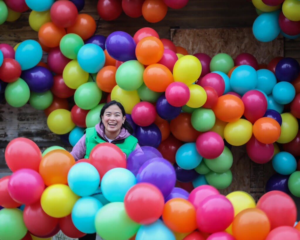Maria Galura surrounded by her balloon art